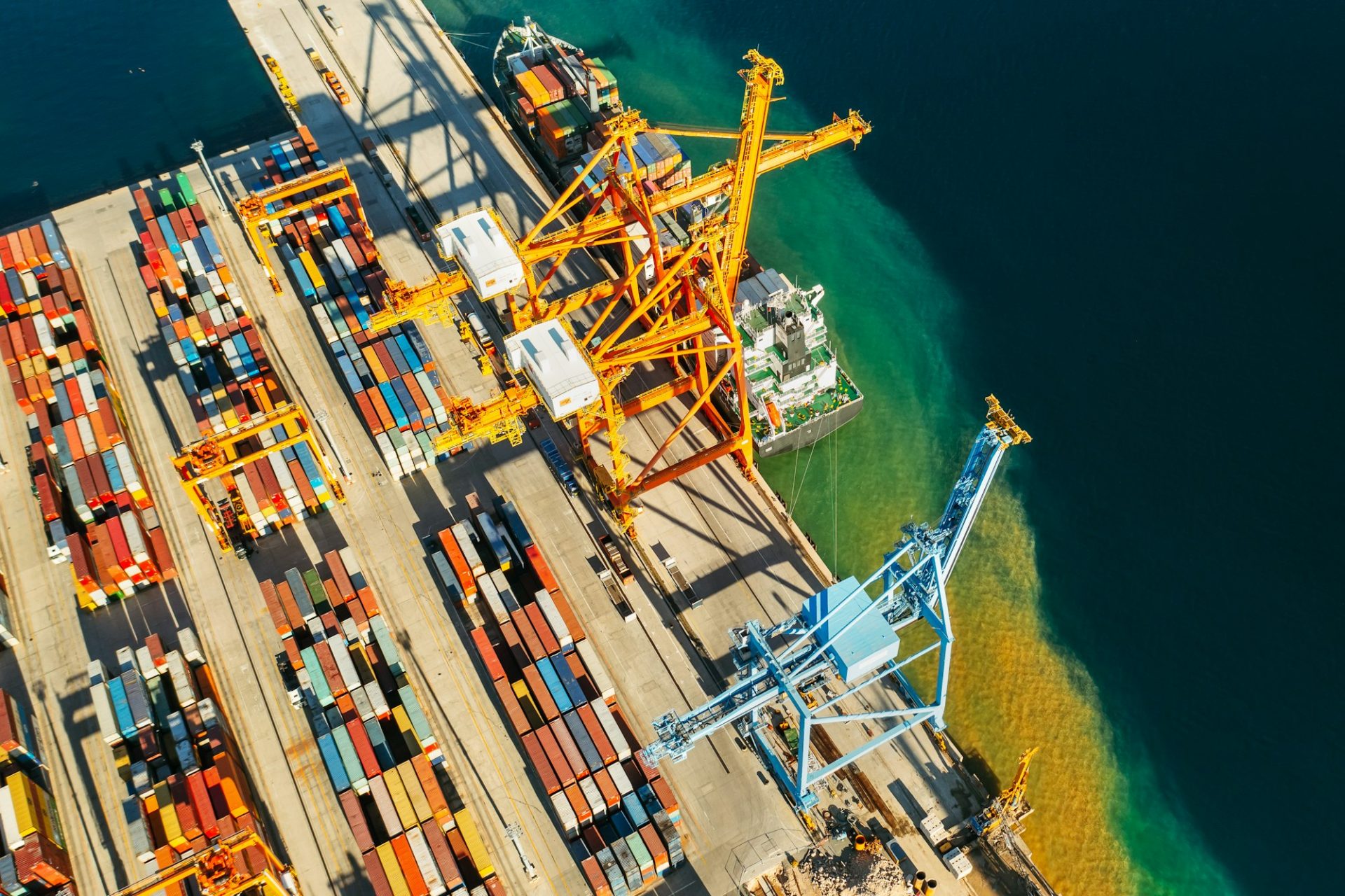 Containers in international shipping dock waiting to import or export and transportation. Top view